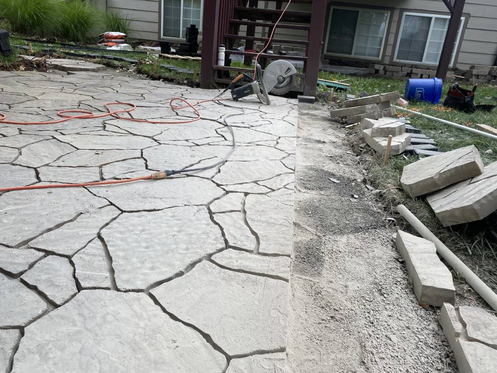 paved gray walkway area with work tools