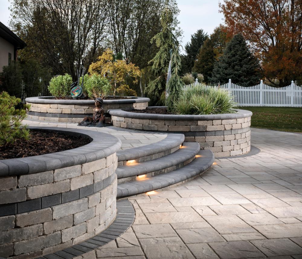 paved walkway with paved with steps and white fence