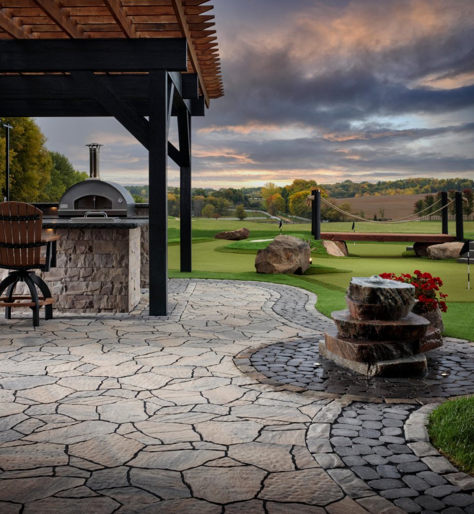 paved walkway with built in kitchen and red flowers