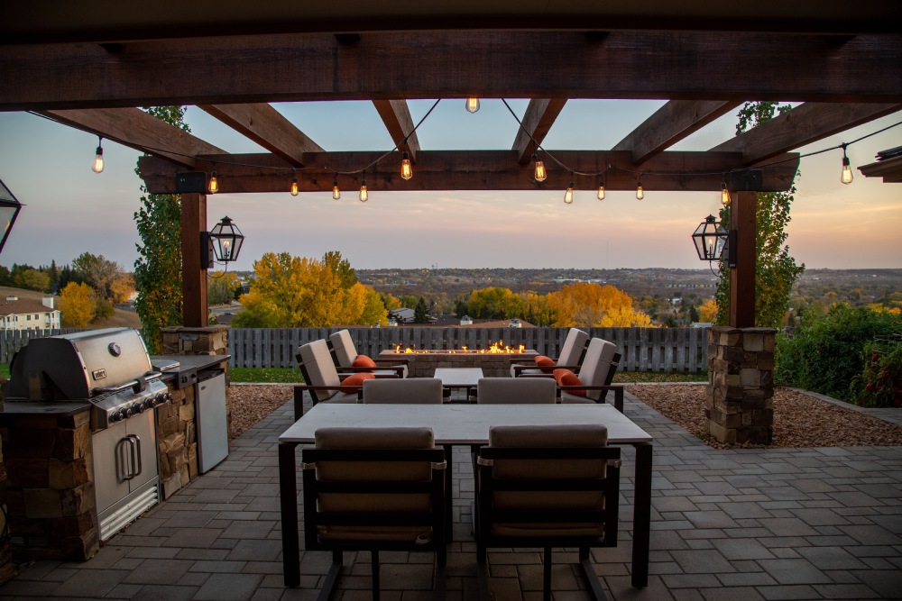 built in kitchen area with white cushioned chairs and tables